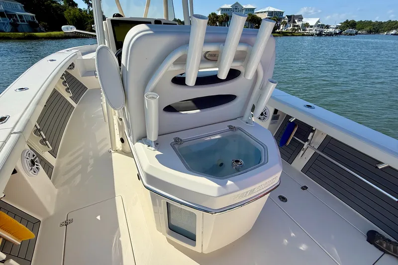 Slide: The Image of 2022 Pathfinder 2700 Open on calm water with modern seating and fishing rod holders. - 44