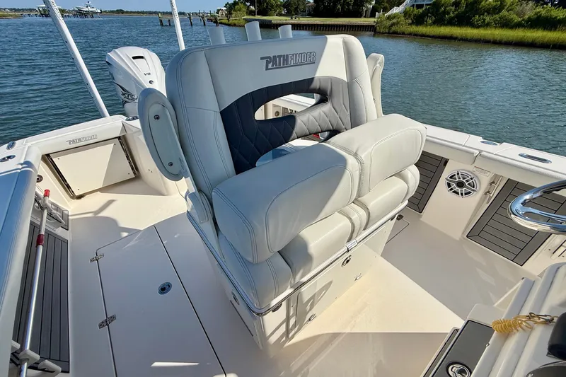 Slide: The Image of The image shows the cockpit of a 2022 Pathfinder 2700 Open with luxurious seating. - 45