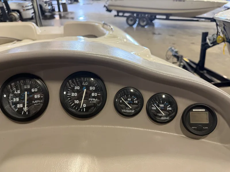 Slide: The Image of Dashboard of a 1996 Chaparral 210 Sunesta with speed and RPM gauges. - 27