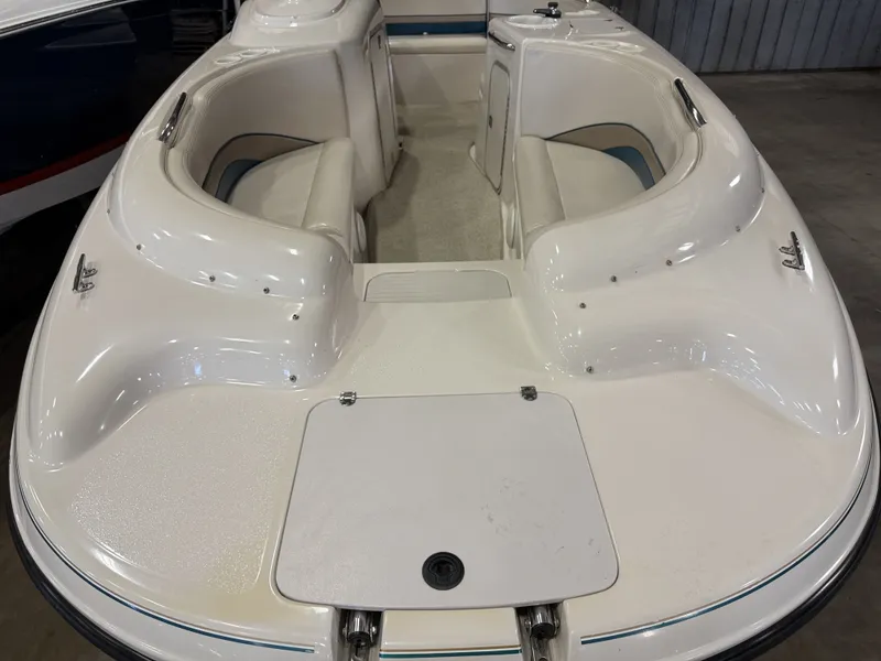 Slide: The Image of The image shows the bow area of a 1996 Chaparral 210 Sunesta boat with seating. - 11