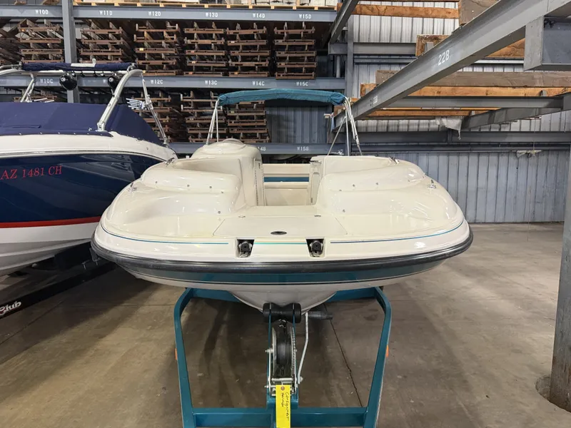 Slide: The Image of A 1996 Chaparral 210 Sunesta is in a storage facility on a trailer. - 8