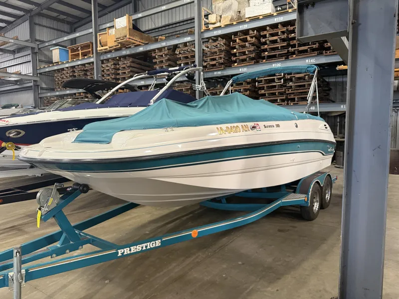 Slide: The Image of A 1996 Chaparral 210 Sunesta on a trailer in a warehouse. - 7