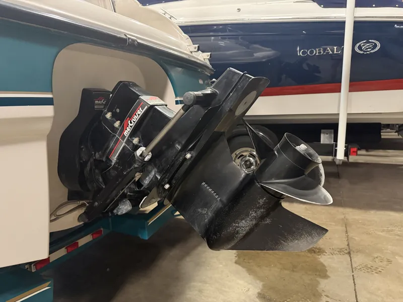 Slide: The Image of Close-up of a boat engine with propeller, mounted on a 1996 Chaparral 210 Sunesta. - 15