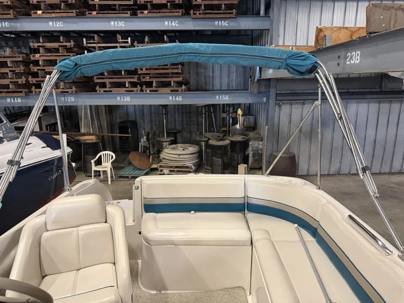 Slide: The Image of Interior view of a 1996 Chaparral 210 Sunesta boat with blue and white seating. - 35