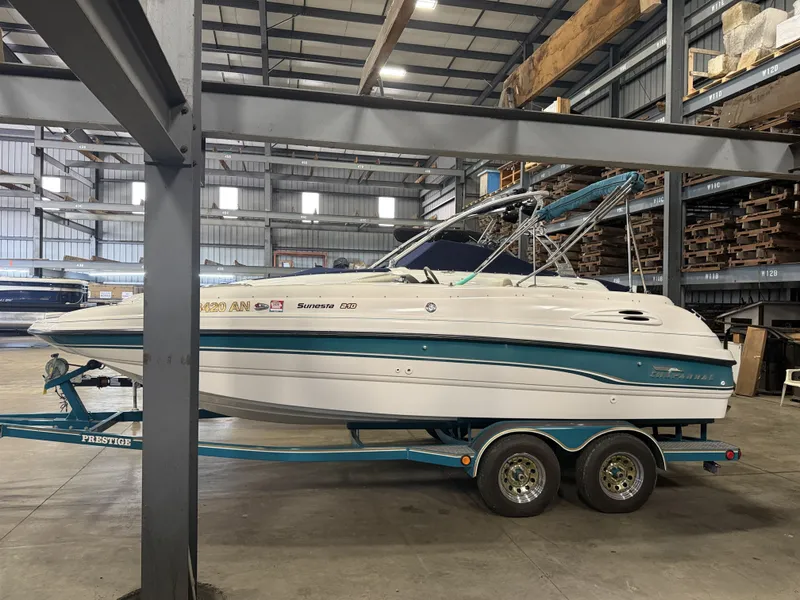 Slide: The Image of A 1996 Chaparral 210 Sunesta on a trailer inside a warehouse. - 4