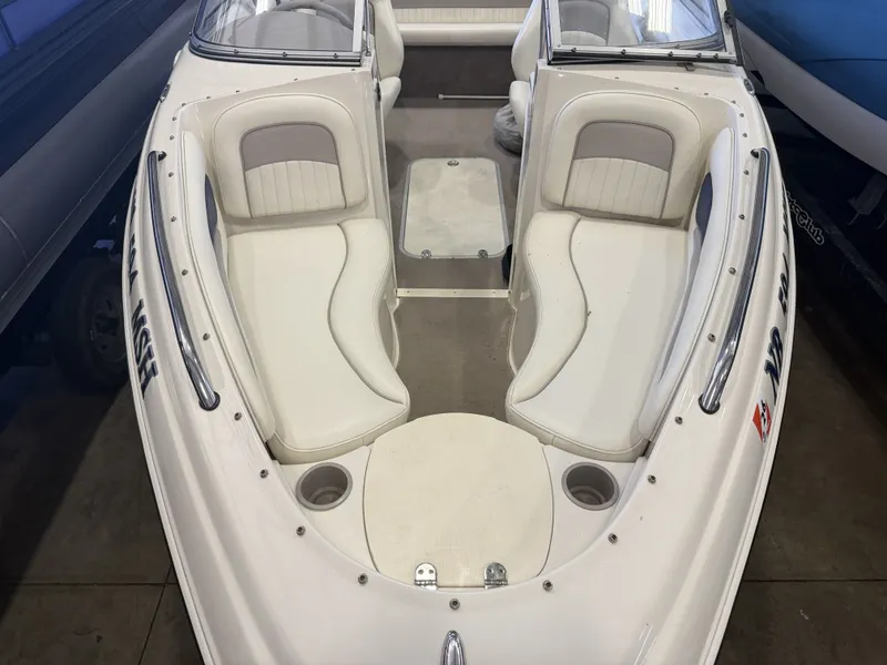 Slide: The Image of The image shows the cockpit of a 2006 Stingray 195 LX with white seating. - 34