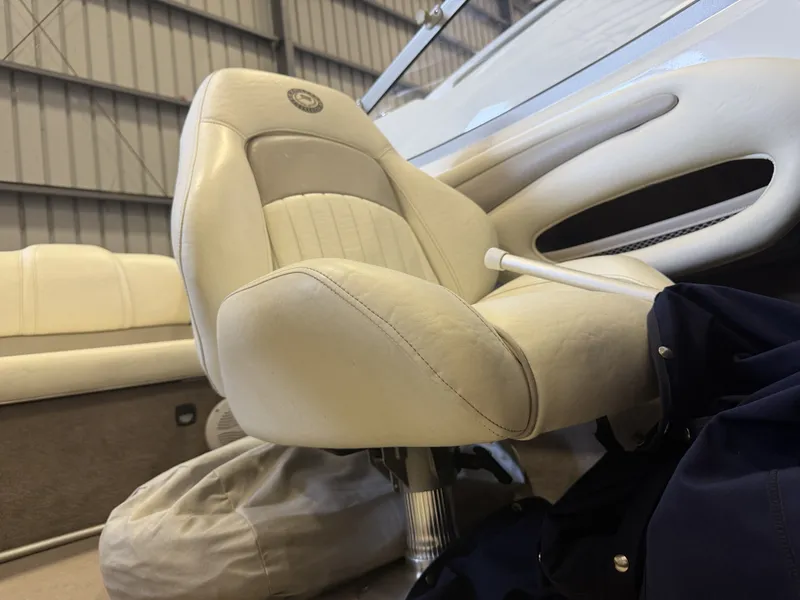 Slide: The Image of A cream-colored boat seat with padded design in an interior setting. - 21