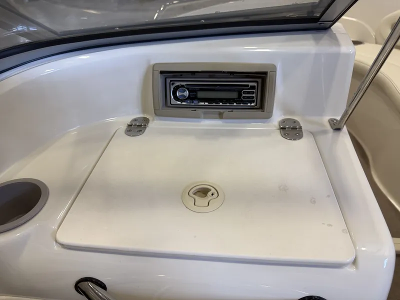 Slide: The Image of The image shows a boat dashboard with a radio and a storage compartment. - 22