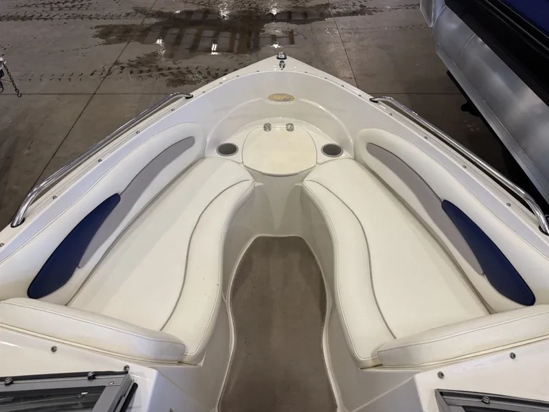 Slide: The Image of Interior view of the bow area of a 2006 Stingray 195 LX with white upholstery. - 29