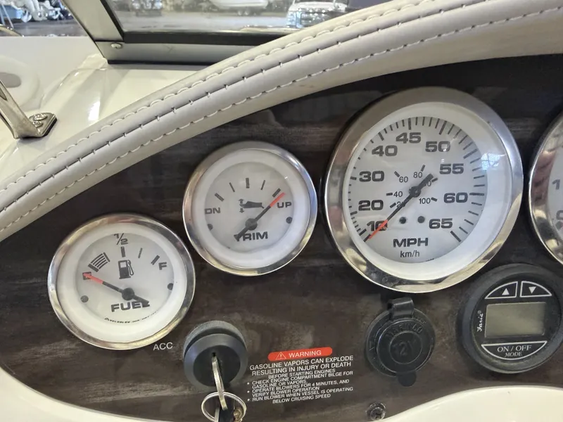 Slide: The Image of Close-up of a boat dashboard with speedometer and fuel gauge. - 17