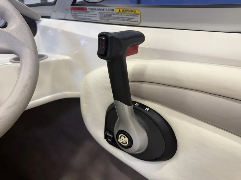 Slide: The Image of Close-up of a boat's throttle lever with white and gray details. - 16