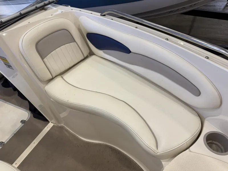 Slide: The Image of The image shows a white seat with blue and gray accents on a boat. - 27