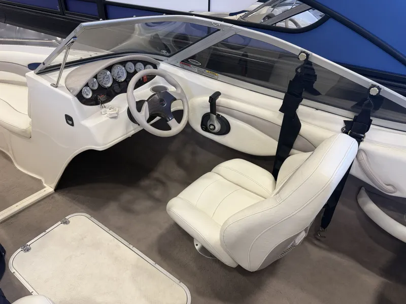 Slide: The Image of Interior of a 2006 Stingray 195 LX with white steering wheel and seats. - 38