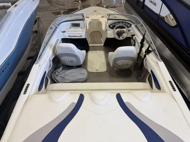 Slide: The Image of Interior view of a 2006 Stingray 195 LX with two seats and a helm station. - 35