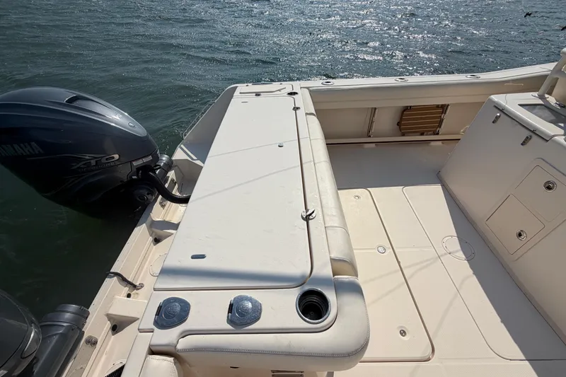 Slide: The Image of 2019 Grady-White Canyon 336 boat deck with Yamaha XTO engine on water. - 57