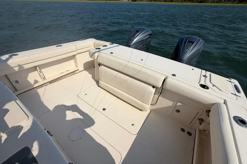 Slide: The Image of 2019 Grady-White Canyon 336 boat deck with twin Yamaha outboard engines. - 53