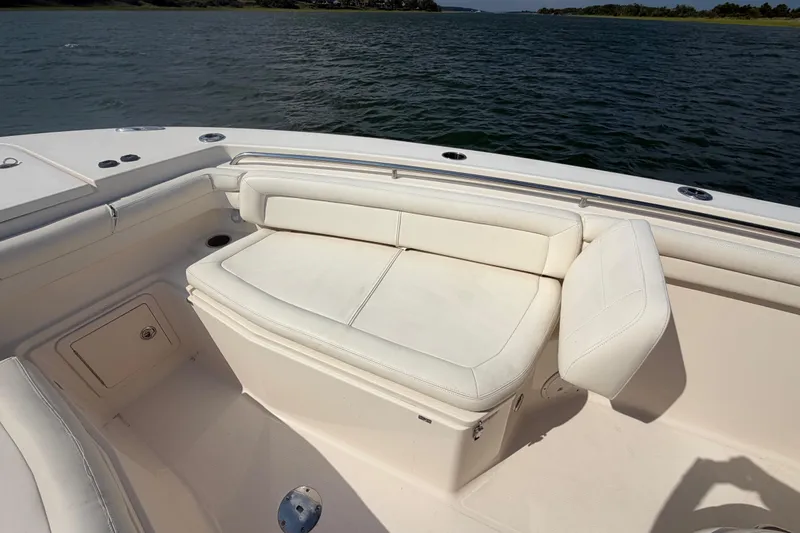 Slide: The Image of 2019 Grady-White Canyon 336 boat with white seating, on calm waters. - 25