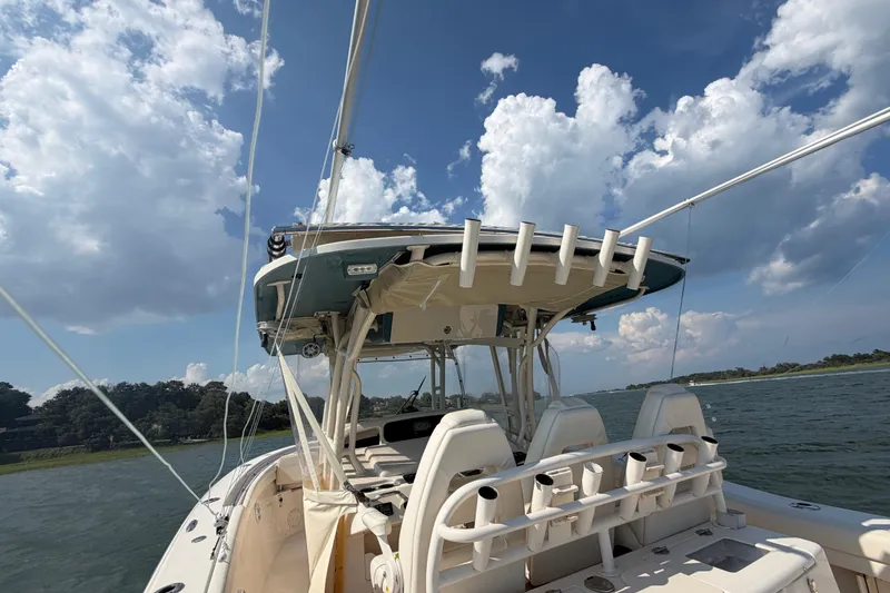 Slide: The Image of 2019 Grady-White Canyon 336 boat on water under cloudy sky. - 50
