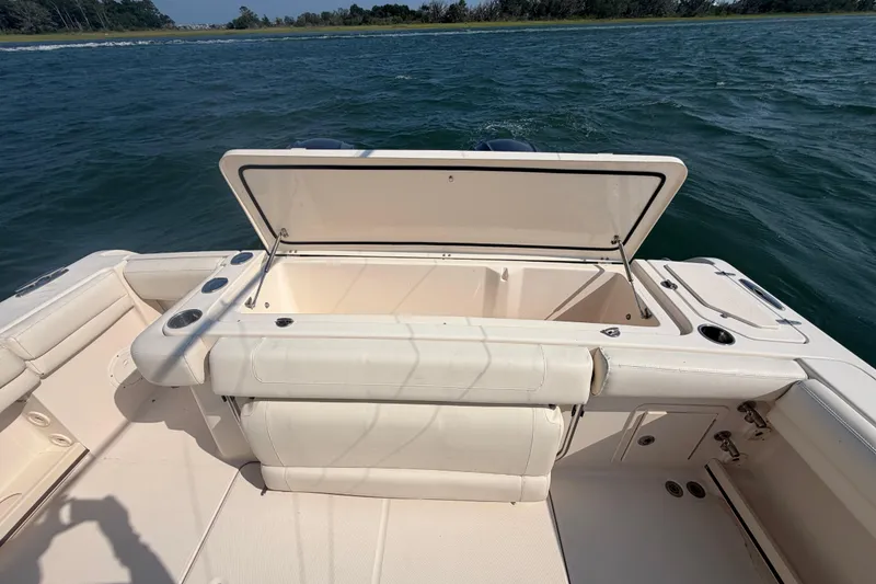 Slide: The Image of 2019 Grady-White Canyon 336 boat with open storage compartment on deck. - 64