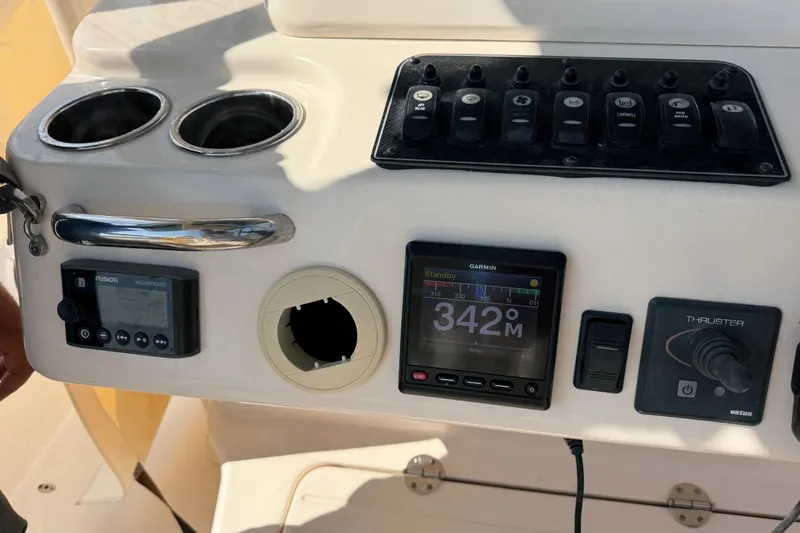 Slide: The Image of Control panel of a 2019 Grady-White Canyon 336 boat with navigation and audio systems. - 48