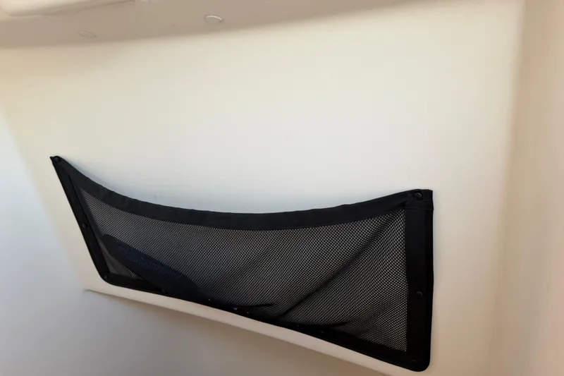 Slide: The Image of Mesh storage pocket on 2019 Grady-White Canyon 336 boat interior wall. - 31