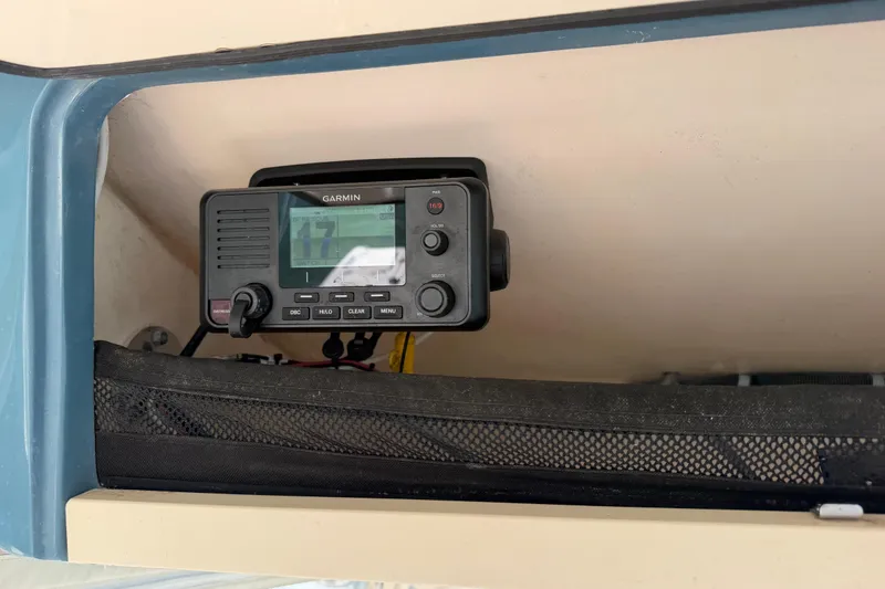 Slide: The Image of Garmin marine radio installed on 2019 Grady-White Canyon 336 boat dashboard. - 38