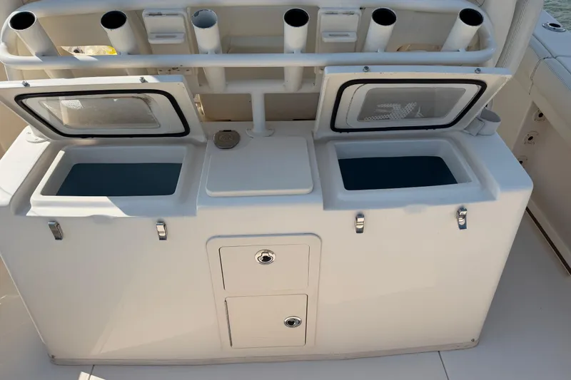 Slide: The Image of 2019 Grady-White Canyon 336 fishing station with storage compartments and rod holders. - 60