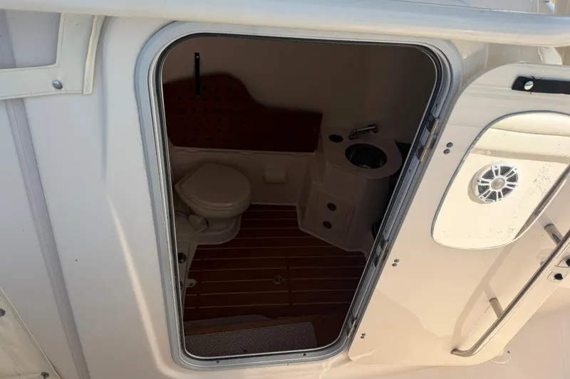 Slide: The Image of 2019 Grady-White Canyon 336 boat interior with toilet and sink. - 27
