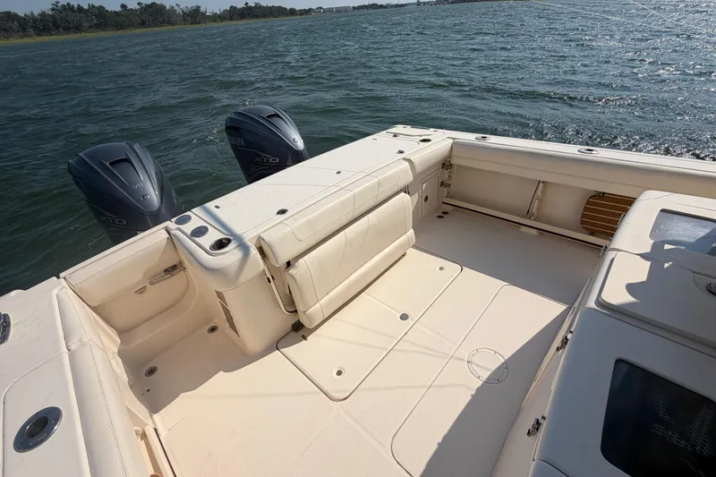 Slide: The Image of 2019 Grady-White Canyon 336 boat with twin Yamaha engines on open water. - 51