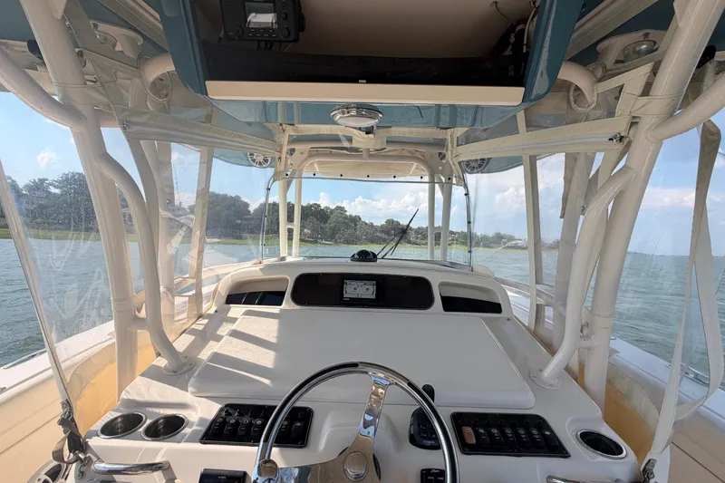 Slide: The Image of 2019 Grady-White Canyon 336 boat interior with steering wheel and control panel. - 41