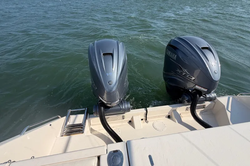 Slide: The Image of 2019 Grady-White Canyon 336 boat with dual Yamaha outboard engines on water. - 56