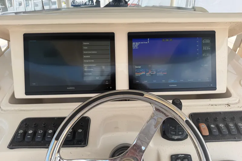 Slide: The Image of Dashboard of 2019 Grady-White Canyon 336 boat with dual Garmin displays. - 45