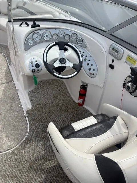 Slide: The Image of The image shows the cockpit of a 2011 Starcraft 2210 boat with a modern helm. - 12