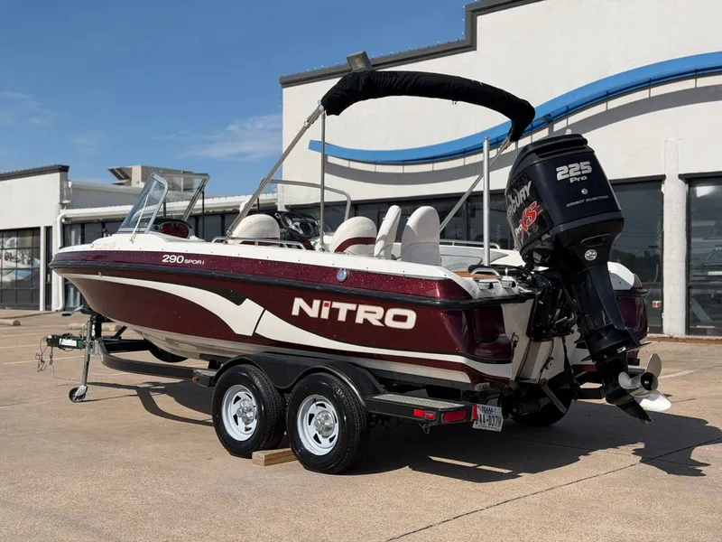 Slide: The Image of A 2013 Nitro 290 Sport boat on a trailer, featuring a 225 HP engine. - 3