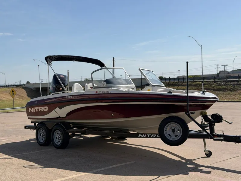 Slide: The Image of A 2013 Nitro 290 Sport boat on a trailer, ready for transport. - 6