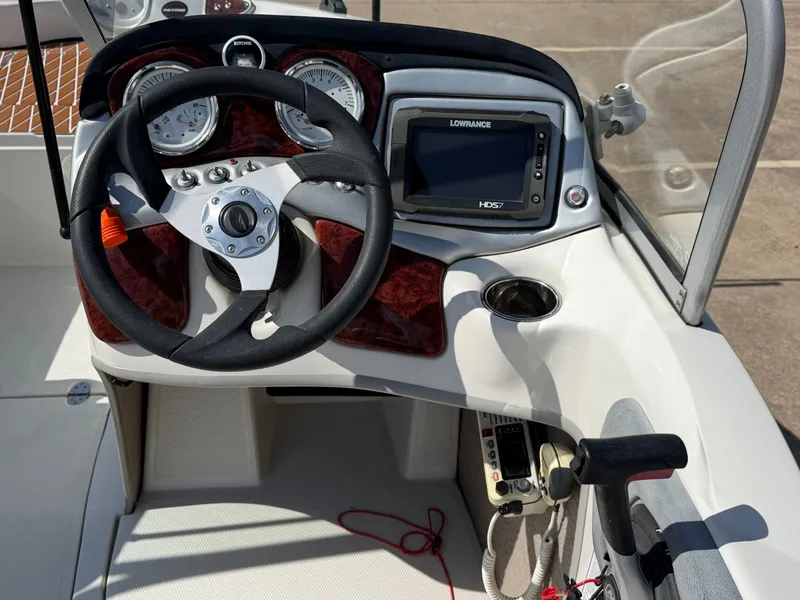 Slide: The Image of Helm of a 2013 Nitro 290 Sport with steering wheel and instruments. - 10