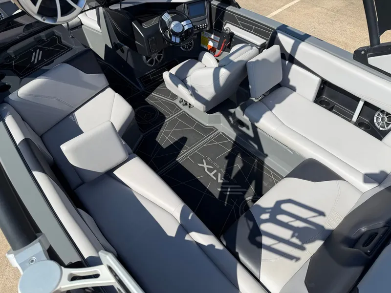 Slide: The Image of Interior view of a 2020 ATX Surf Boats 22 Type-S with gray seating and modern dashboard. - 10