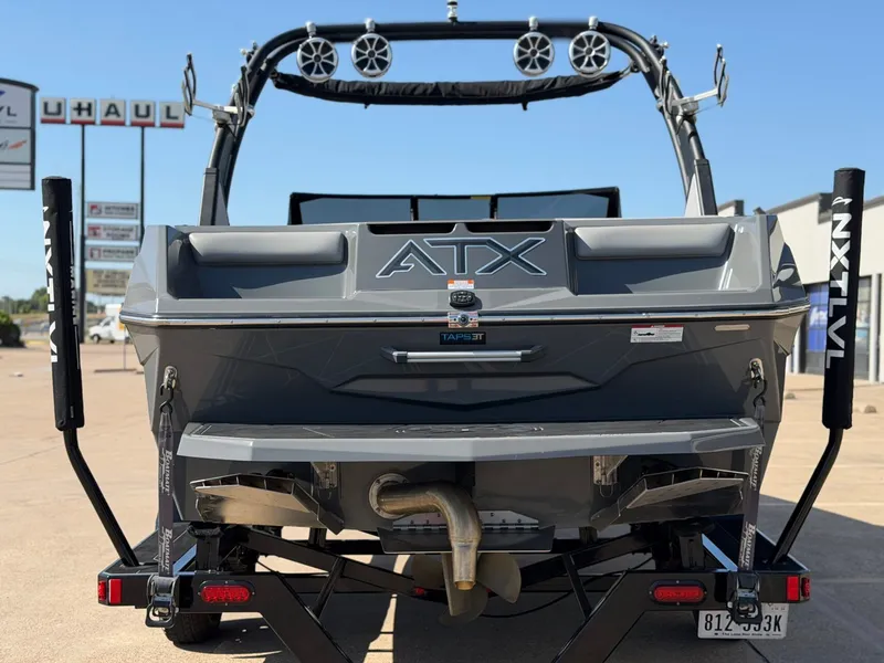 Slide: The Image of The image shows a gray ATX Surf Boat, model 22 Type-S, from 2020 on a trailer. - 4
