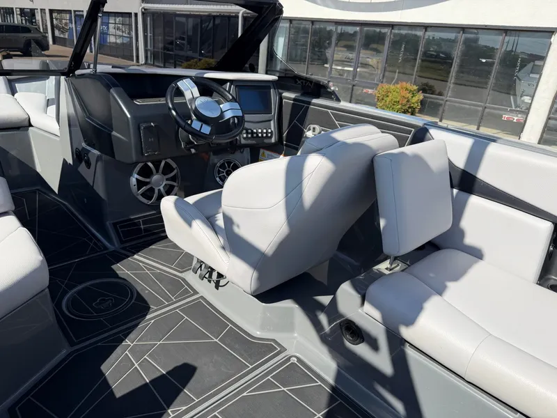 Slide: The Image of The image shows the cockpit of a 2020 ATX Surf Boats 22 Type-S with gray seating. - 11