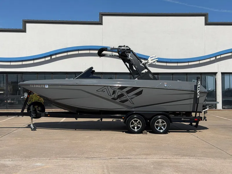 The Image of A gray 2020 ATX Surf Boat 22 Type-S on a trailer in front of a building. - 1