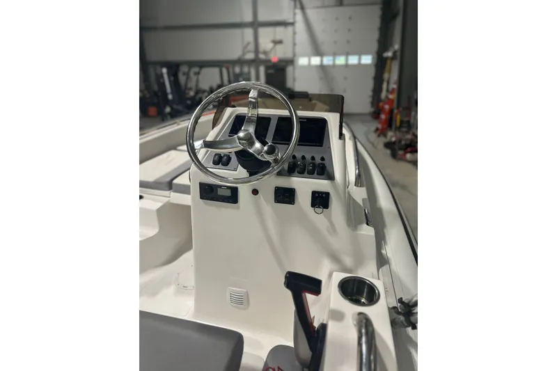 Slide: The Image of 2022 AB Inflatables Nautilus 17 DLX boat console with steering wheel and controls. - 14