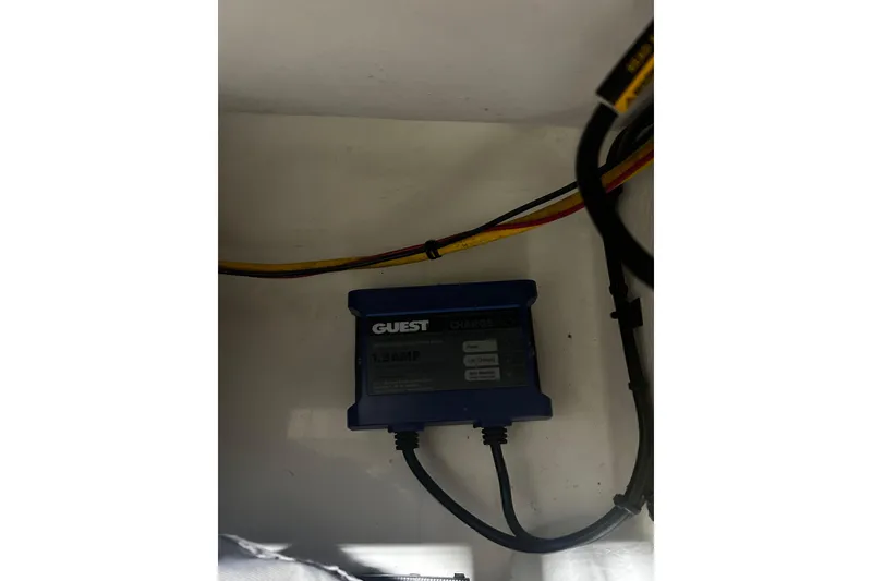 Slide: The Image of Battery charger inside 2022 AB Inflatables Nautilus 17 DLX boat compartment. - 17