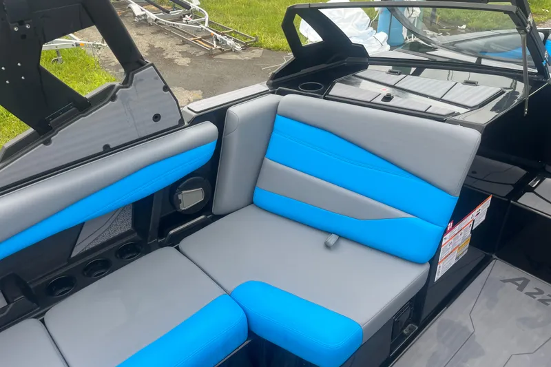 Slide: The Image of 2026 Axis A225 boat interior with blue and gray seating, showcasing modern design. - 3