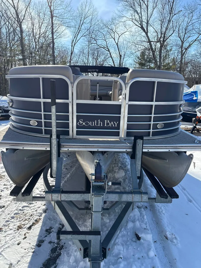 Slide: The Image of A 2008 South Bay 922CR pontoon boat is on a trailer in the snow. - 5