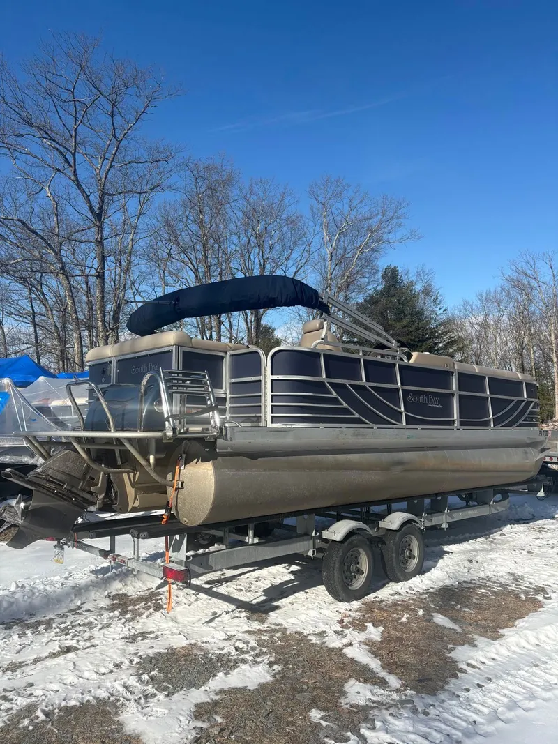 Slide: The Image of 2008 South Bay 922CR pontoon boat on a trailer in the snow. - 8