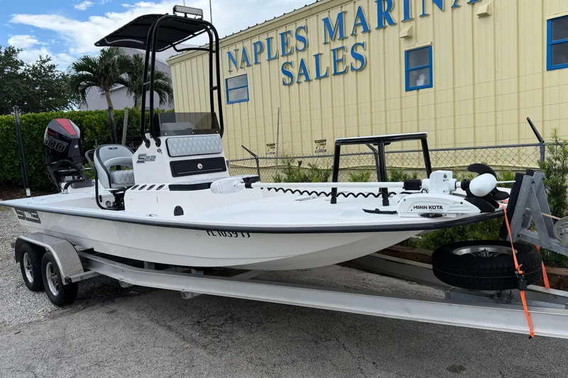 Slide: The Image of 2022 SCB S22 boat on trailer at Naples Marina Sales, featuring Minn Kota motor. - 3