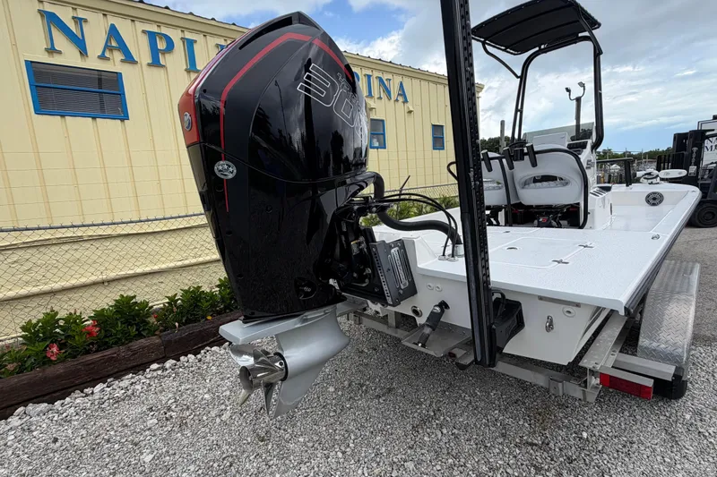 Slide: The Image of 2022 SCB S22 boat with powerful outboard motor at marina, showcasing sleek design. - 4