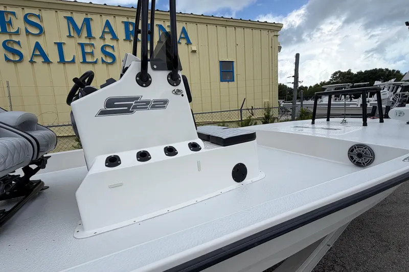 Slide: The Image of 2022 SCB S22 boat at marina sales, featuring sleek white deck and console. - 20