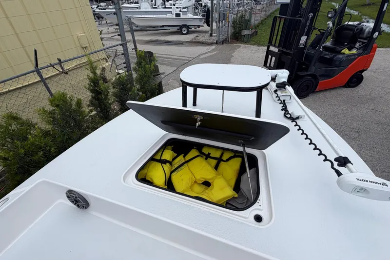 Slide: The Image of 2022 SCB S22 boat with open storage compartment containing yellow life jackets. - 24