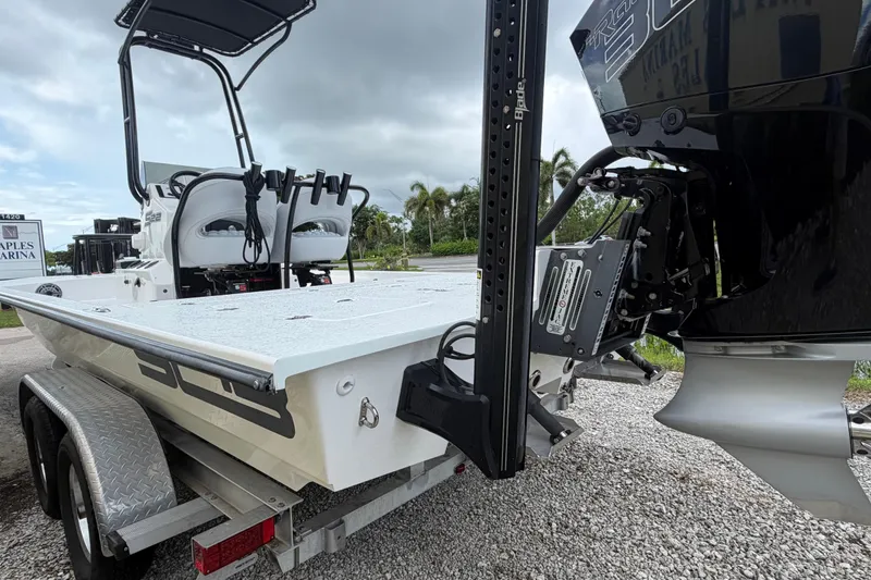 Slide: The Image of 2022 SCB S22 boat on trailer, featuring powerful outboard motor and sleek design. - 5